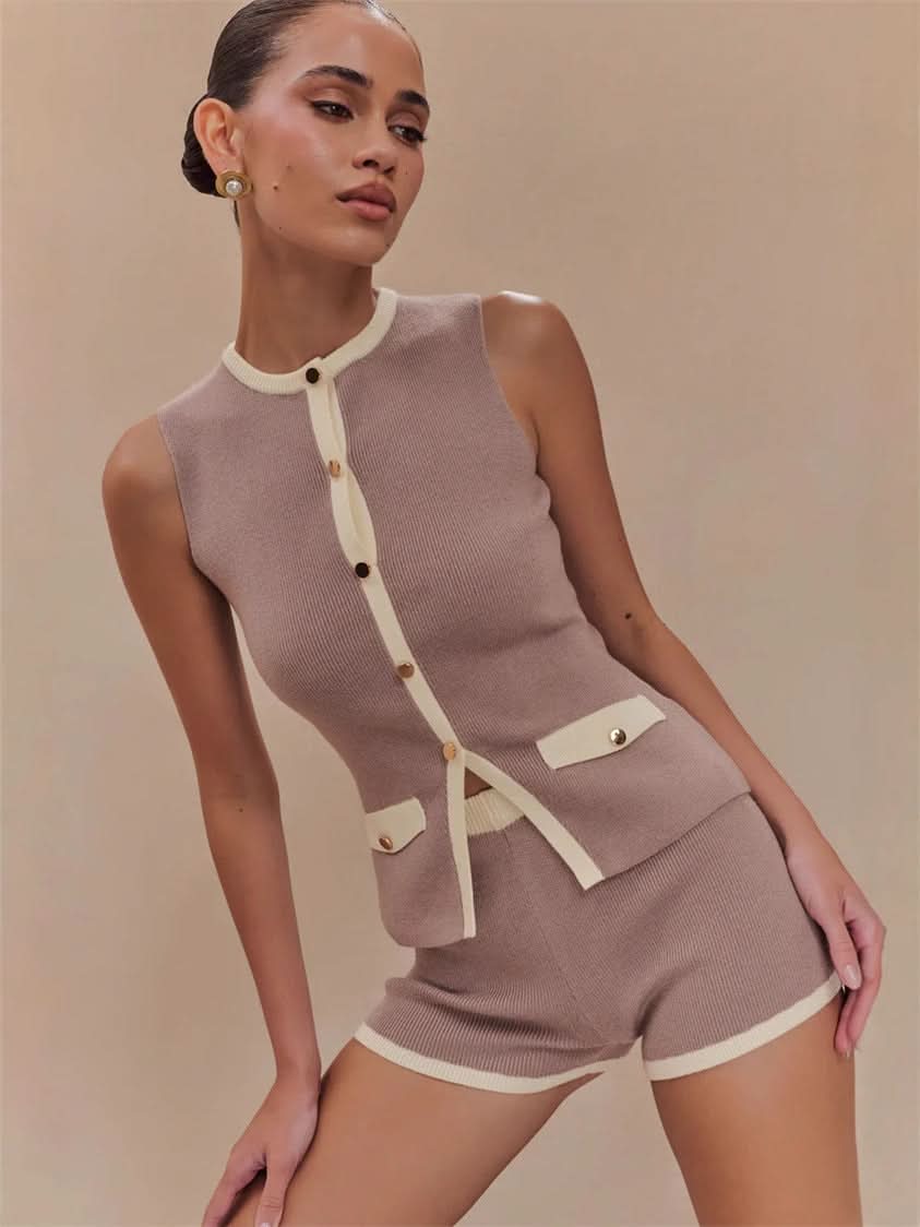 Beige ribbed knit vest with white trim and button front fastening