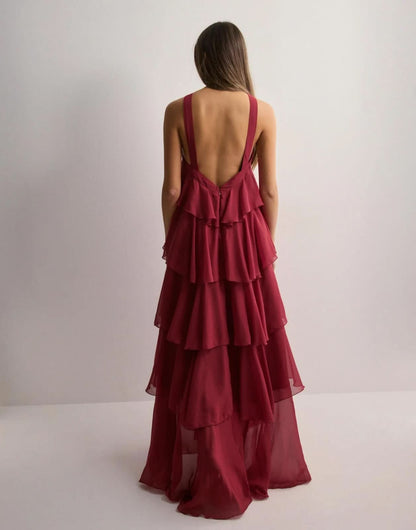 Burgundy maxi dress back view with open back design and tiered ruffled skirt