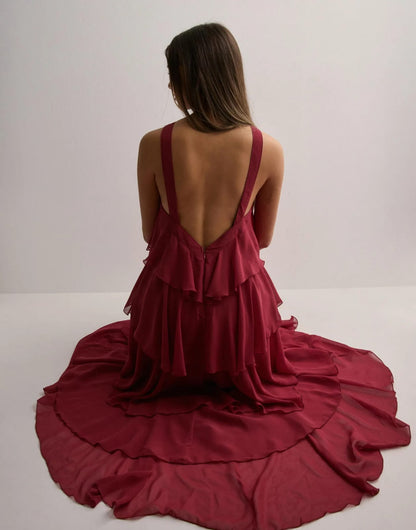 Burgundy tiered maxi dress with low open back and flowing ruffled layers