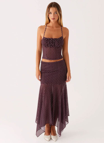 Burgundy polka dot camisole crop top with asymmetrical handkerchief skirt