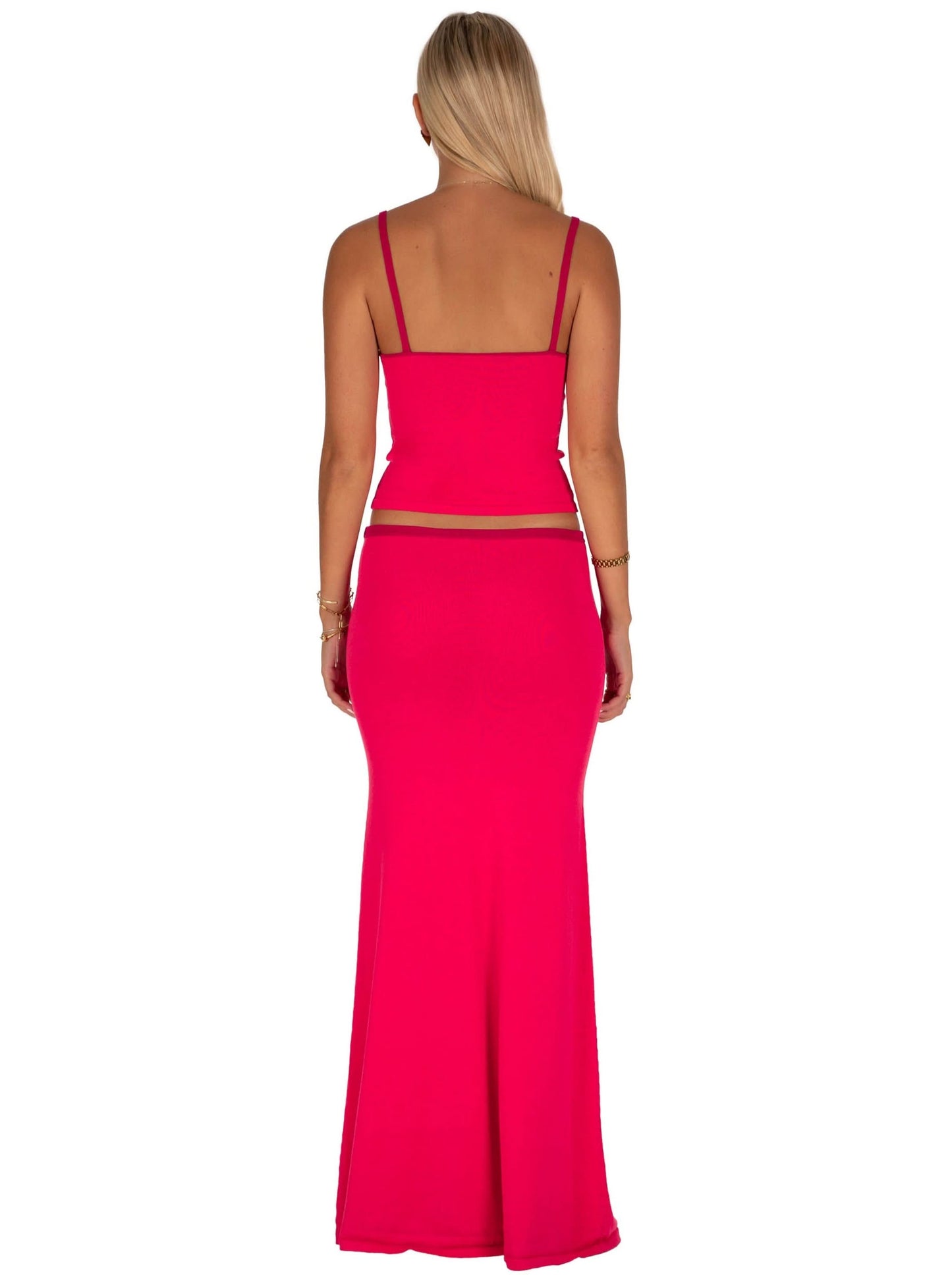 Back view of pink two-piece set with spaghetti straps and cutout waist detail