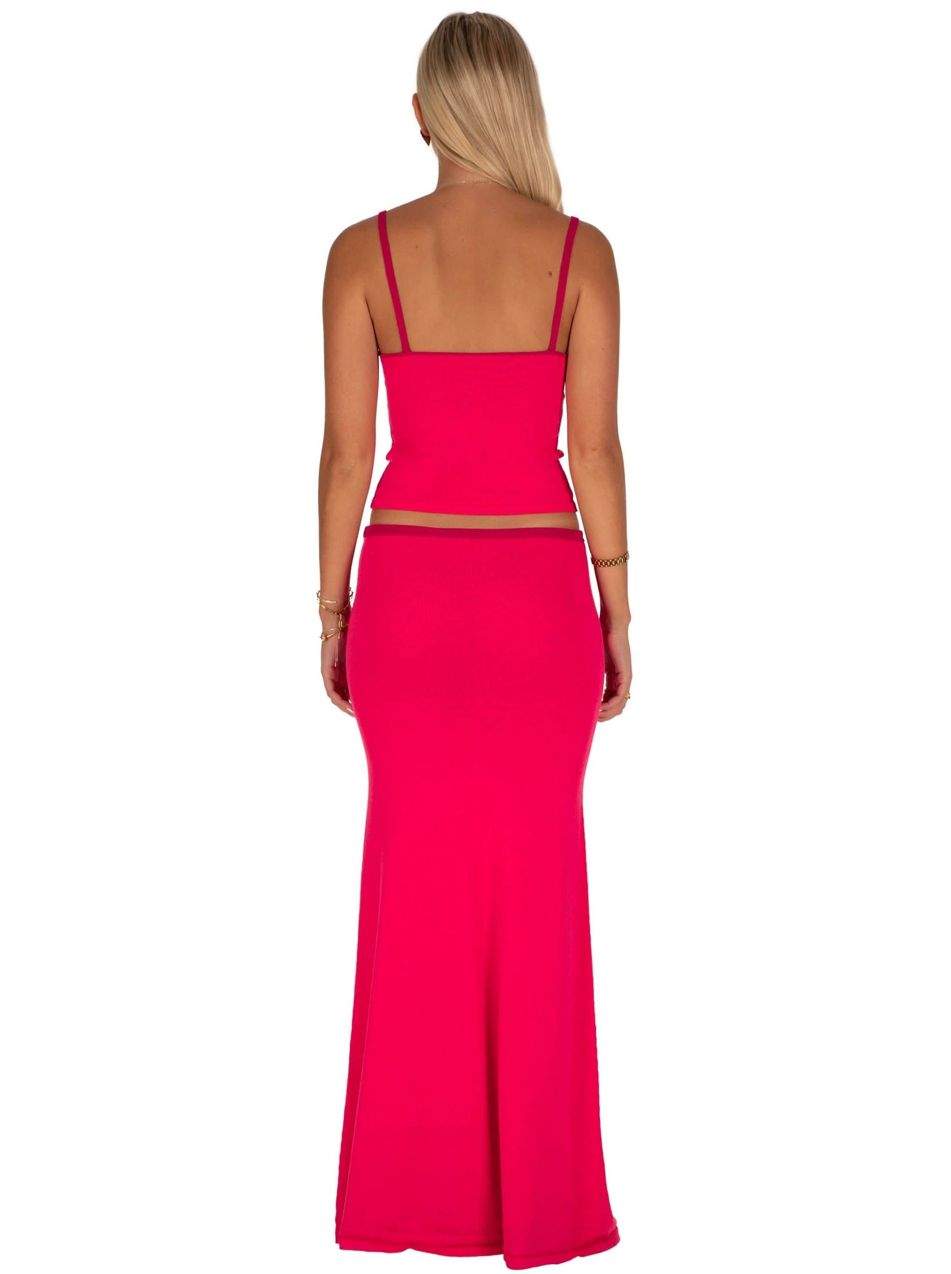Back view of pink two-piece set with spaghetti straps and cutout waist detail