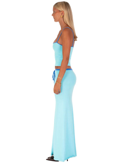 Side view of light blue maxi set showing fitted crop top and flowing floor-length skirt