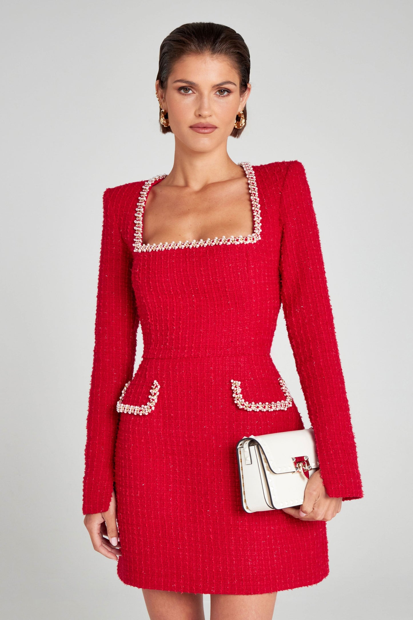 Red mini dress with long sleeves, pearl-trimmed neckline and pockets
