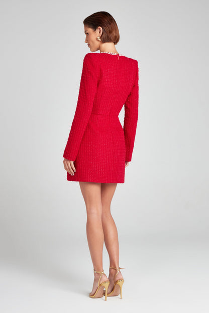 Back view of red textured mini dress with long sleeves