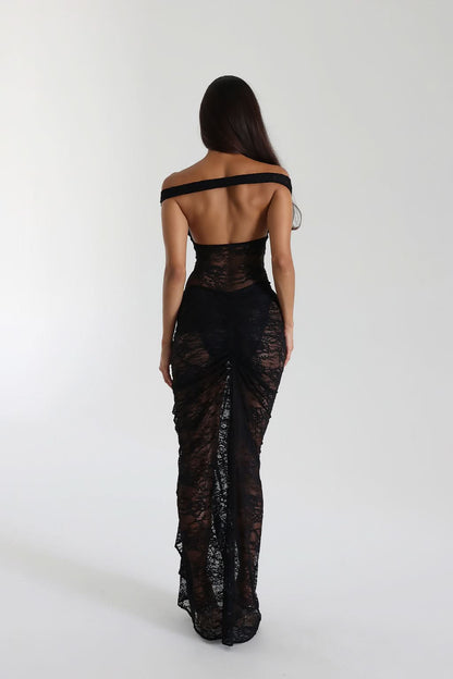 Back view of black lace maxi dress with off-shoulder strap and ruched skirt