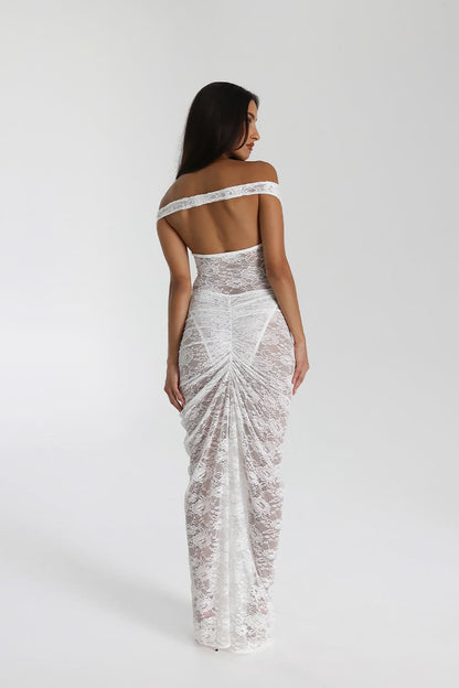Back view of white lace evening gown with off-shoulder design and draped skirt
