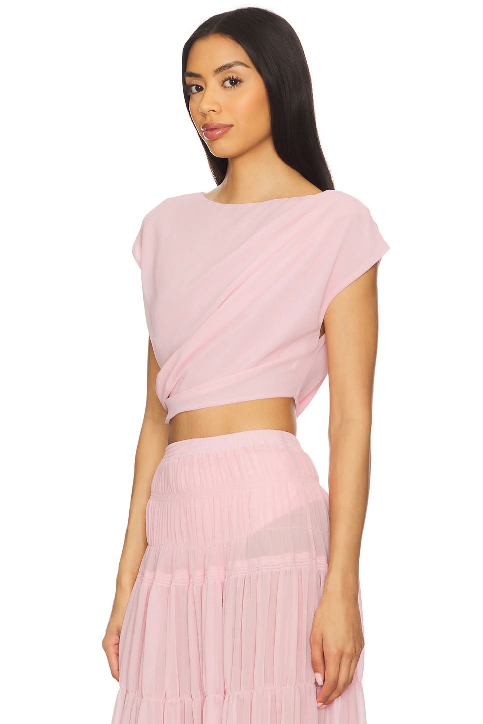 Pink two-piece summer set showing draped crop top and tiered pleated maxi skirt front view