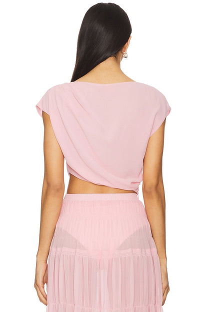 Back view of pink draped crop top and tiered pleated maxi skirt summer set
