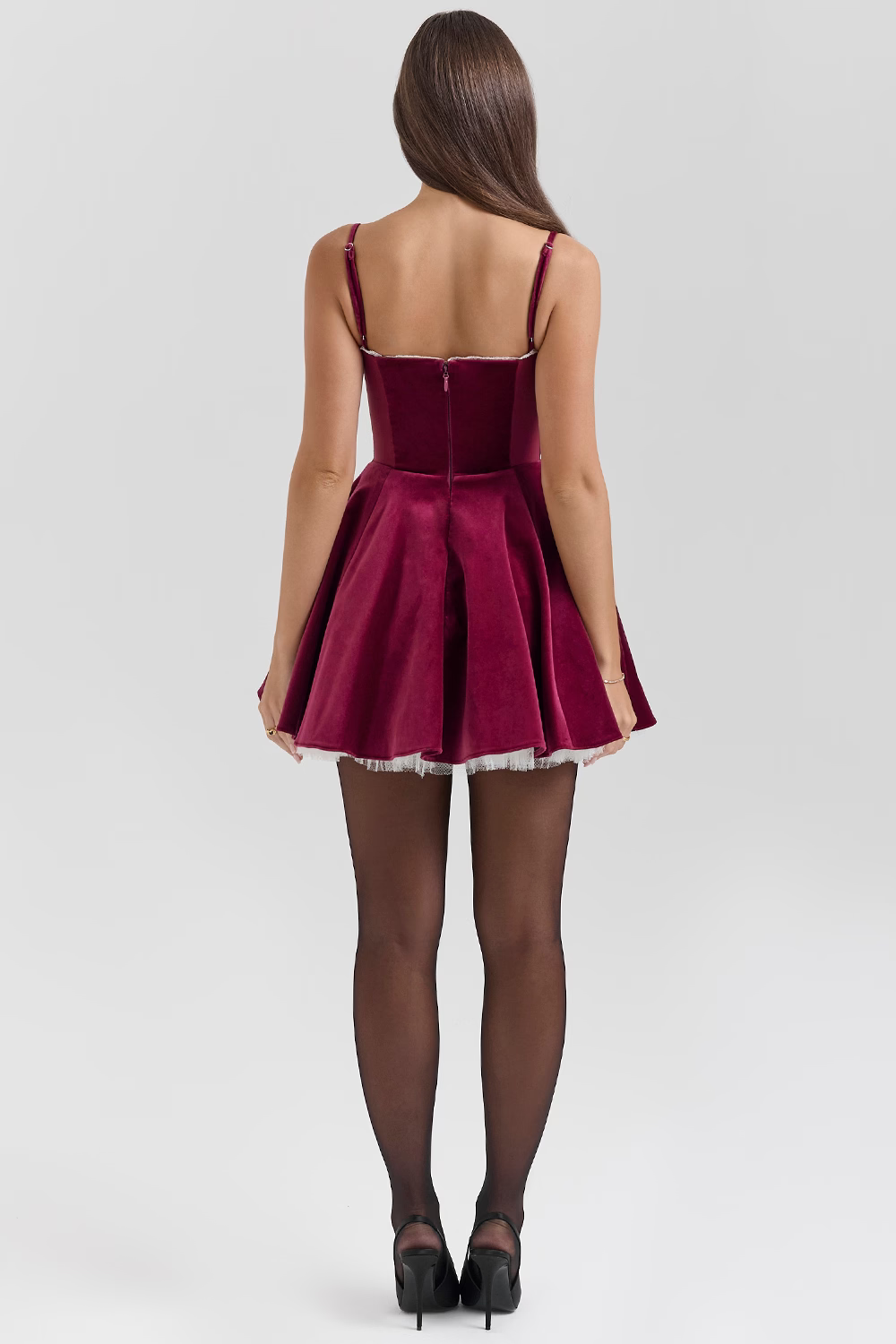 Rear view of burgundy velvet sweetheart mini dress with full circle skirt