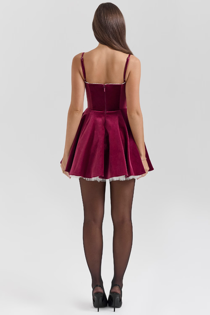 Rear view of burgundy velvet sweetheart mini dress with full circle skirt
