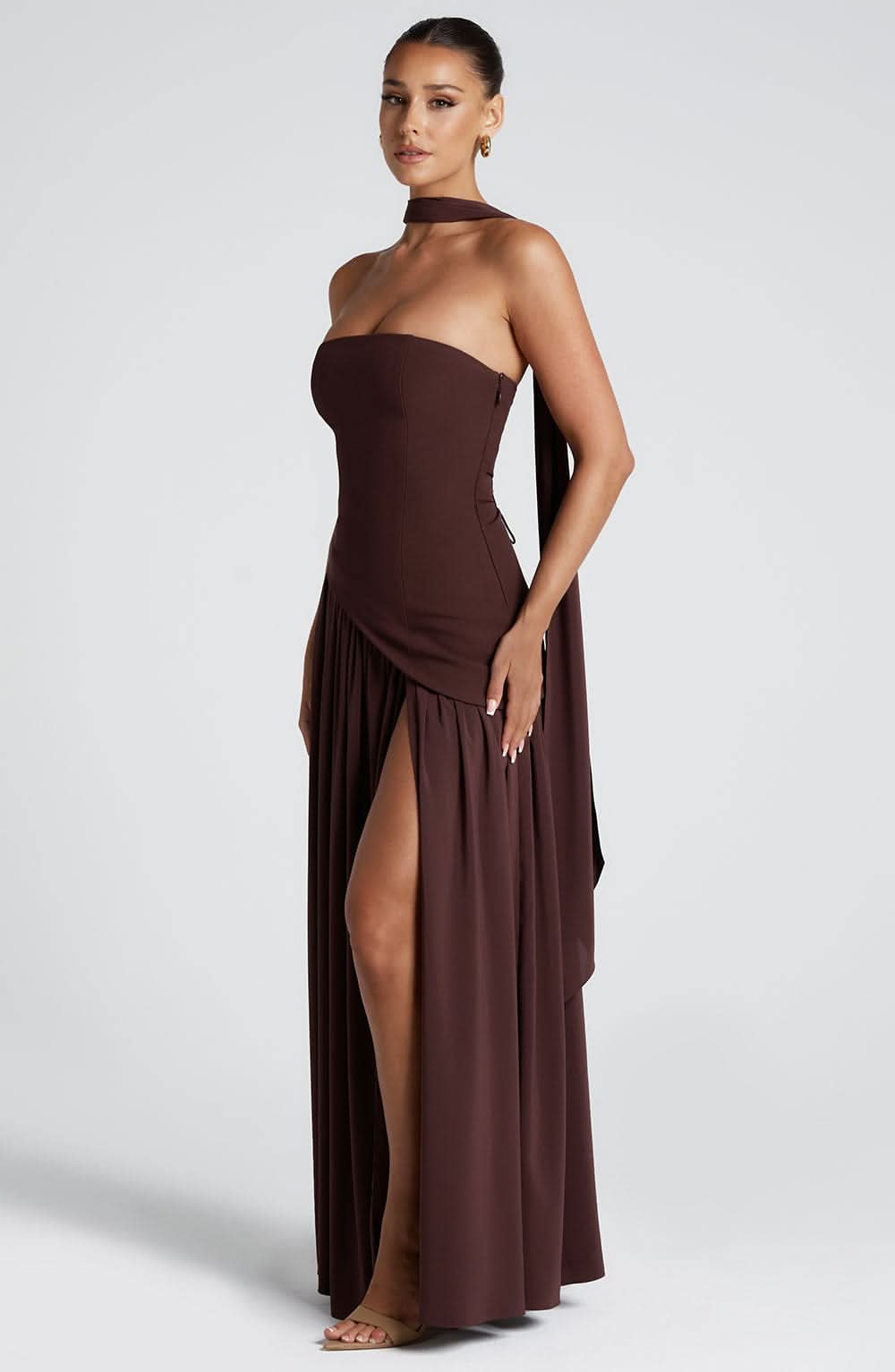 Brown strapless evening maxi dress with diagonal overlay and side slit