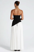 Back view of black and white color-block maxi dress with slit