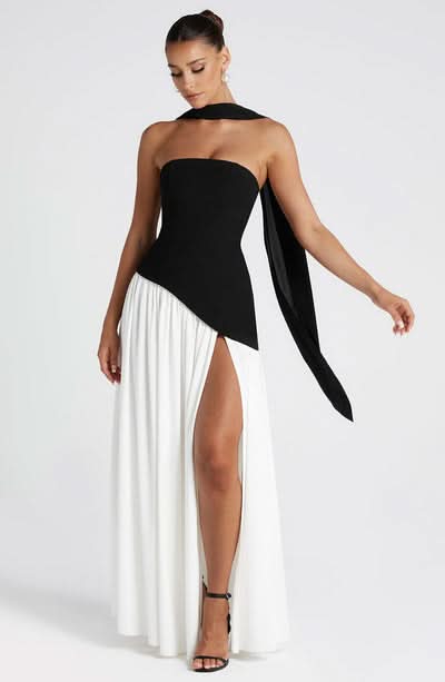 Black and white maxi dress with draped halter detail and leg slit