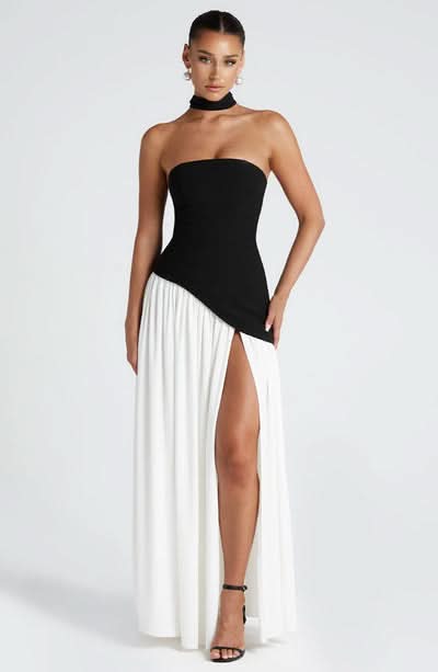 Black and white strapless maxi dress with asymmetric bodice slit