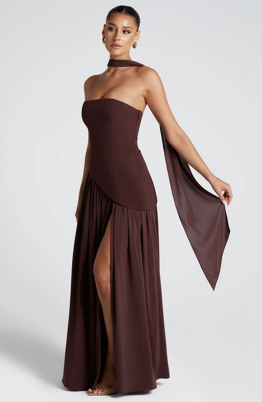 Brown halter maxi dress with ruched bodice and flowing pleated skirt