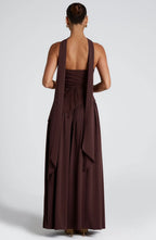 Back view of brown maxi dress showing open back and draped fabric details