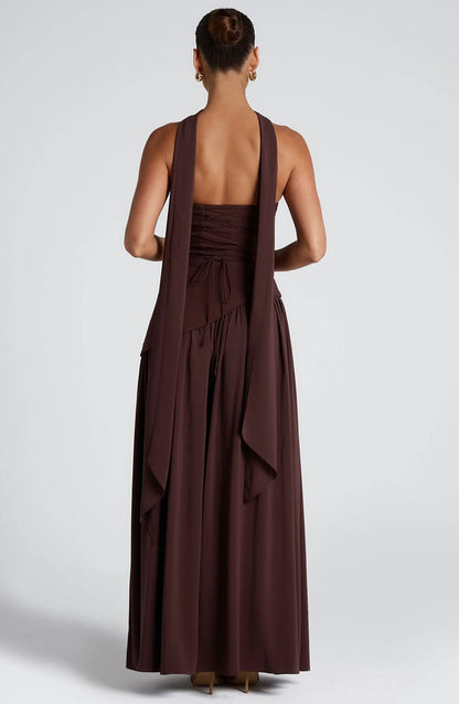 Back view of brown maxi dress showing open back and draped fabric details