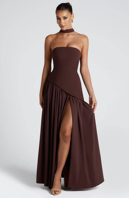 Brown strapless maxi dress with high leg slit and flowing pleated hem