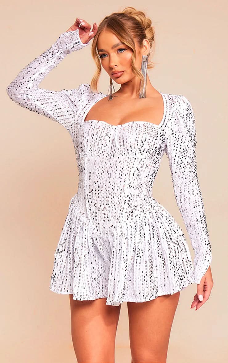White sequined mini dress with long sleeves and fitted bodice detail