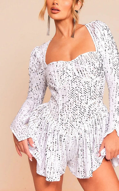 Close-up of white sequin dress neckline with puffed shoulder sleeve