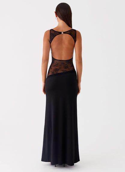 Back view of black maxi dress with open back and lace waist insert