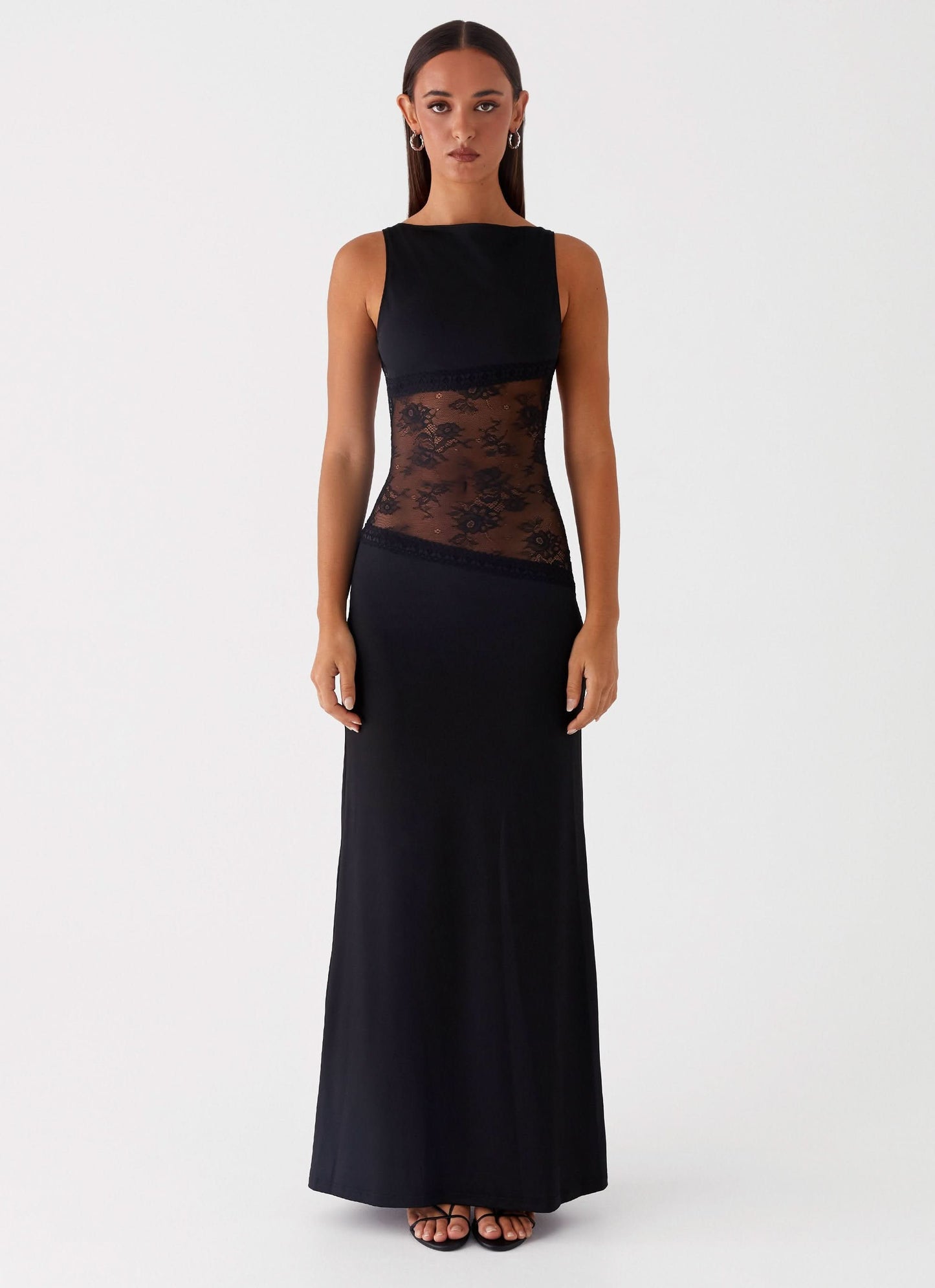 Black sleeveless maxi dress with sheer lace waist panel and solid bodice