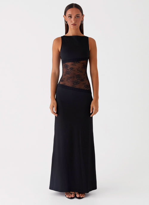 Black sleeveless maxi dress with sheer lace waist panel and solid bodice