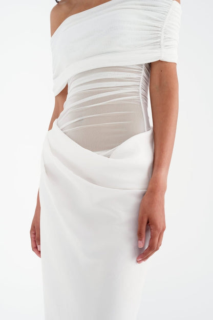 Close-up of white maxi dress bodice with horizontal ruching and cutout design