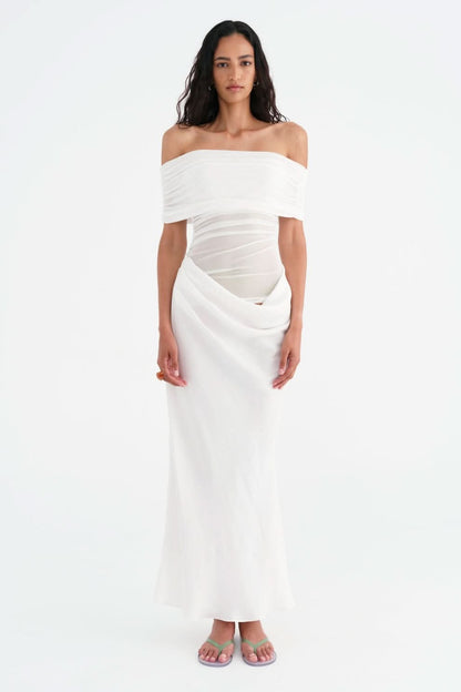 White off-shoulder maxi dress with wrapped waist and asymmetrical drape