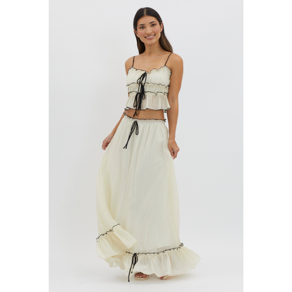 Cream two-piece maxi skirt set with ruched crop top and flowing skirt with ruffled hem