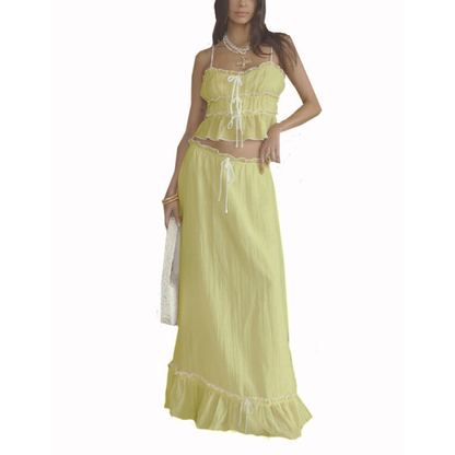 Yellow maxi skirt set with ruched crop top and ruffled hem detail on skirt