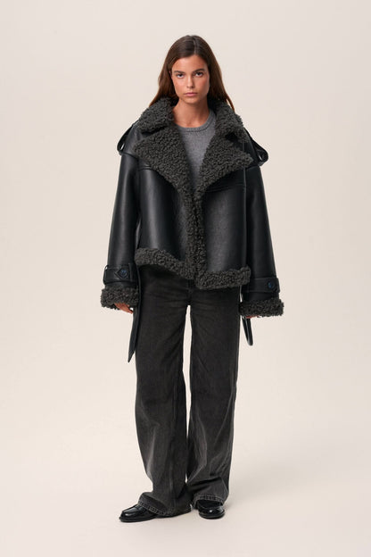 Black leather cropped coat with oversized charcoal fleece collar, open front view