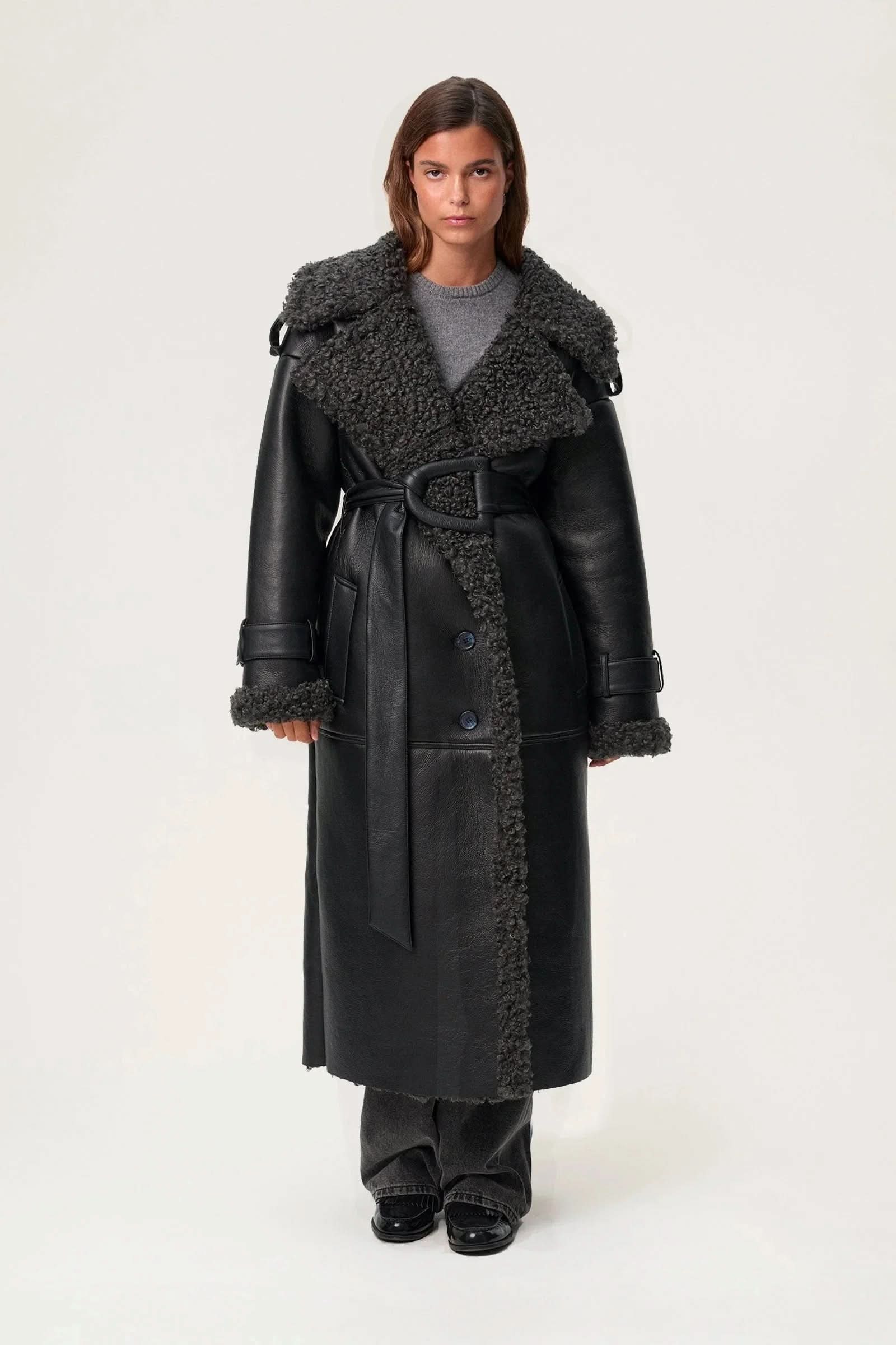 Black leather cropped coat with wide charcoal fleece collar and button front closure
