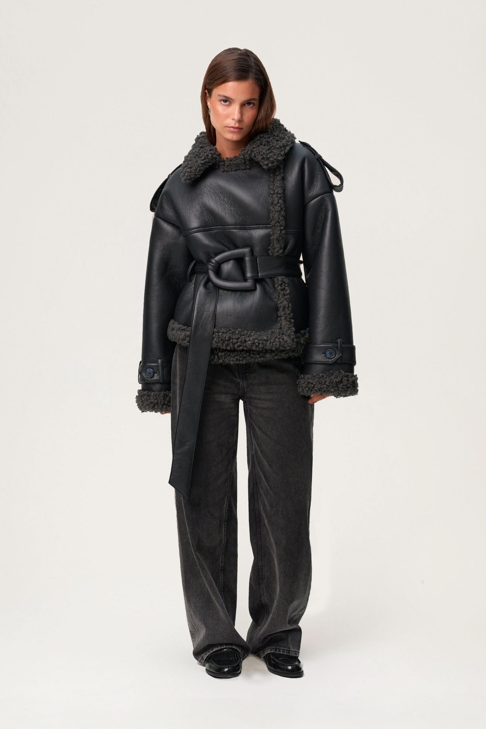 Black leather cropped coat with charcoal fleece collar and cuffs, belted waist