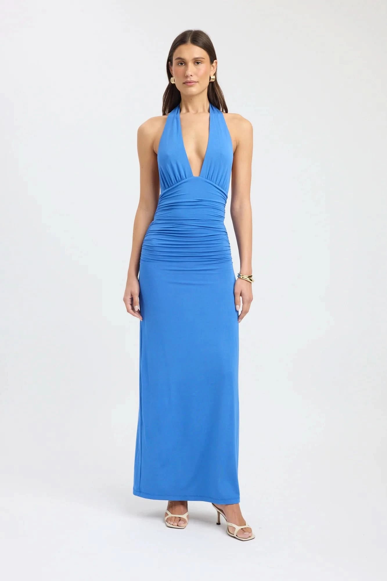 Blue halter maxi dress with ruched waist and deep V-neckline