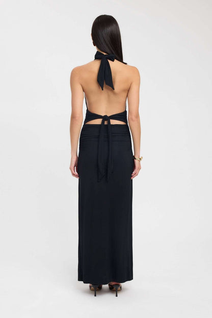 Back view of black maxi dress showing open back with tie detail
