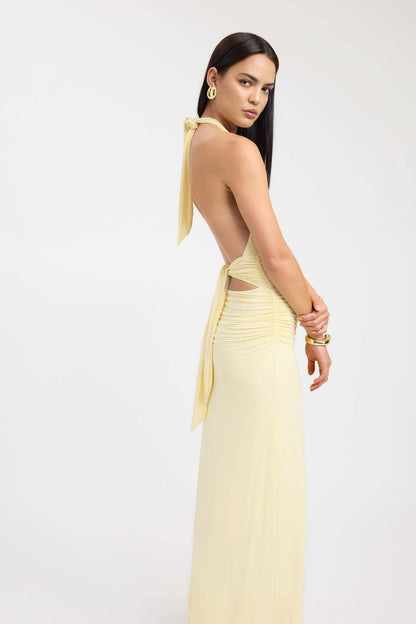 Pale yellow halter maxi dress with ruched waist and open back tie