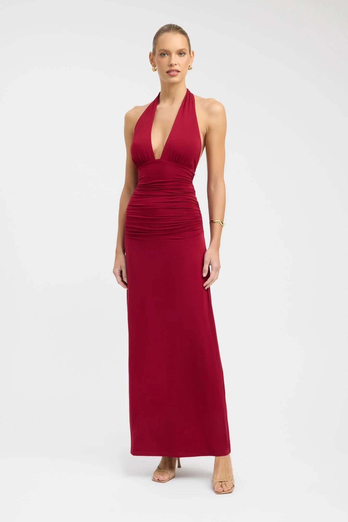 Deep red halter maxi dress with plunging V-neck and ruched waist