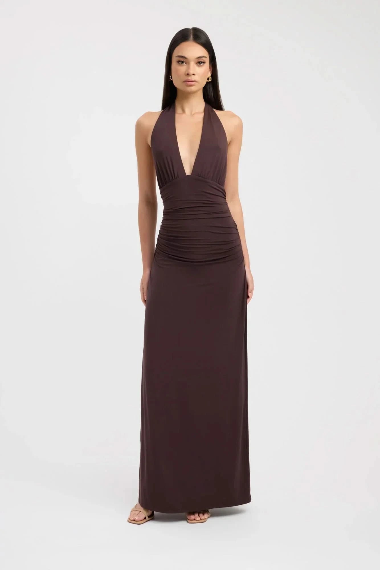Brown halter maxi dress with deep V-neckline and ruched waist detail