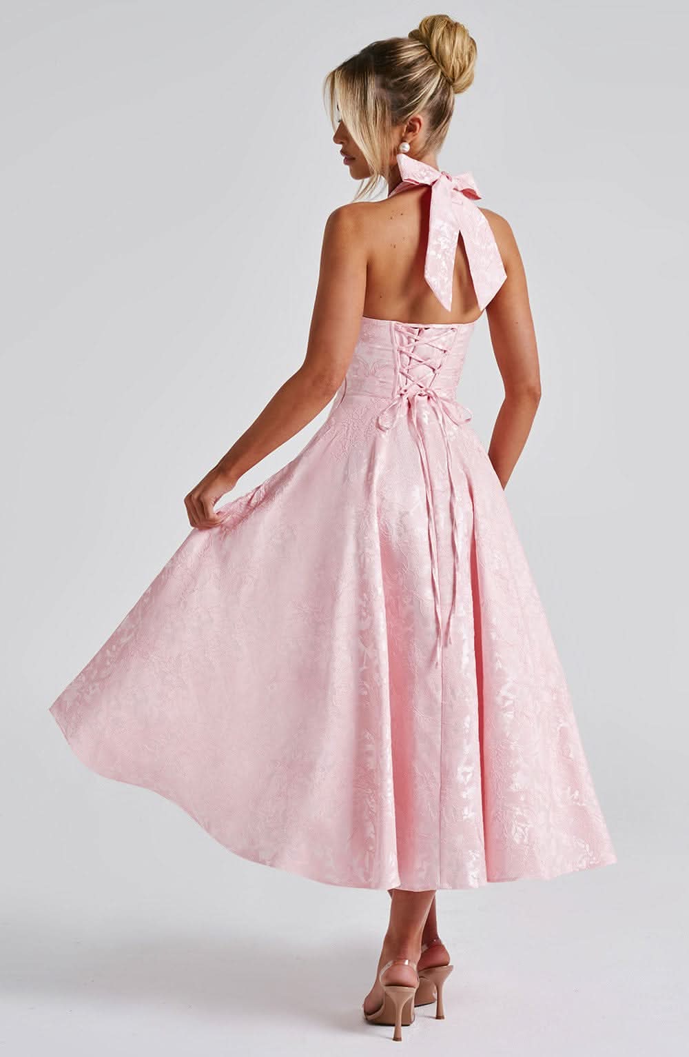 Pink jacquard midi dress with halter neckline and lace-up back detail