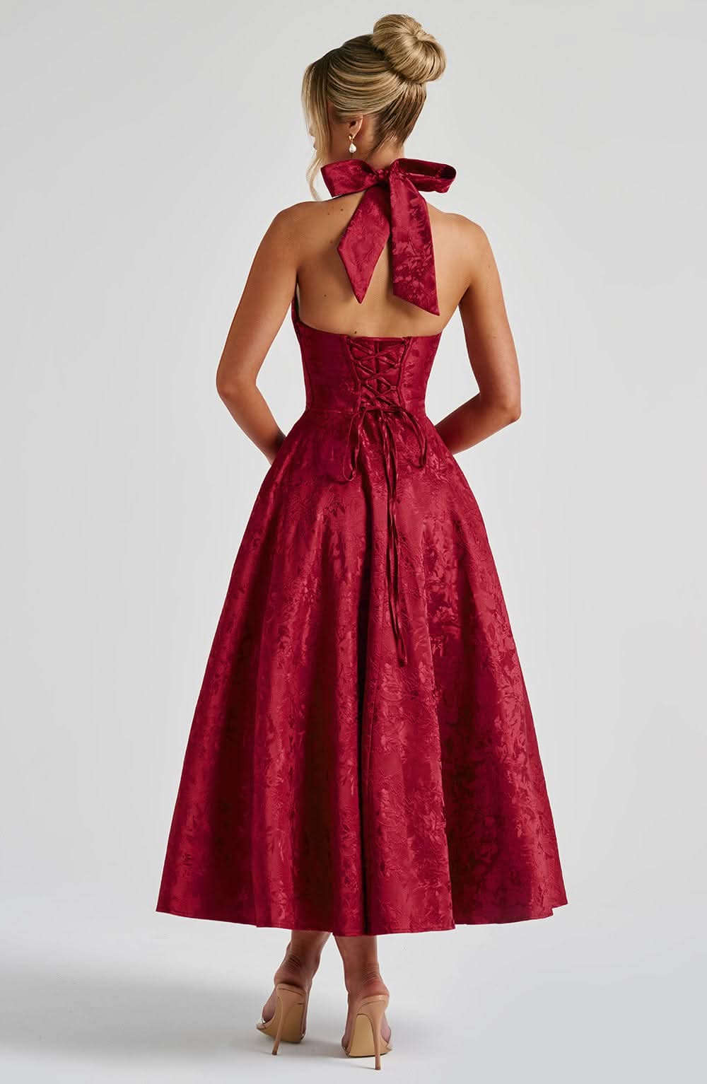 Burgundy velvet midi dress with halter neck and lace-up corset back