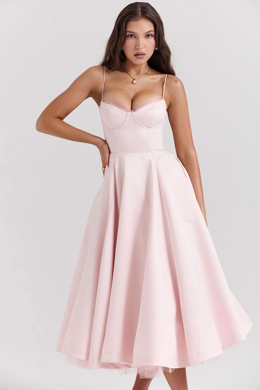 Blush midi dress with thin straps and voluminous tulle skirt