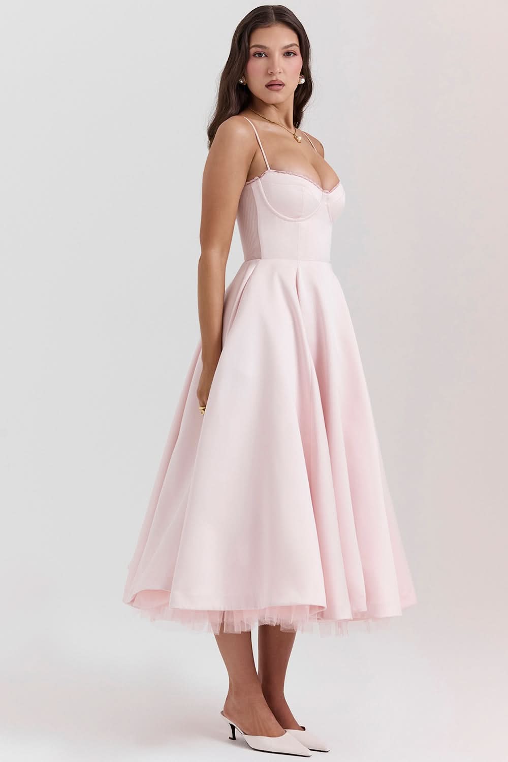 Blush midi dress with spaghetti straps and asymmetrical tulle hem