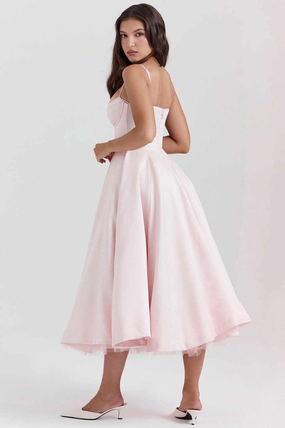 Blush midi dress back view showing spaghetti straps and full skirt