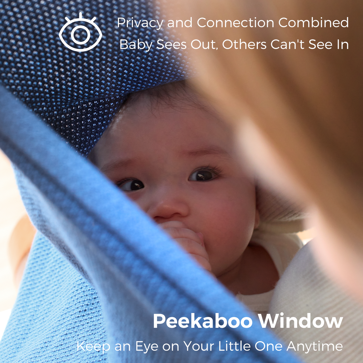 Close-up of blue nursing cover peekaboo window showing baby's face with privacy mesh detail