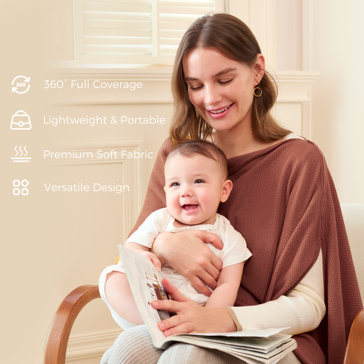 Mother in rust nursing cover holding smiling baby while reading with full coverage design