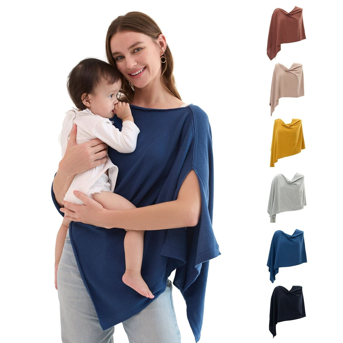 Navy blue textured nursing cover draped over shoulder while cradling infant