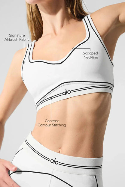 Back view of white sports bra and shorts set showing sweetheart shaping and contour design