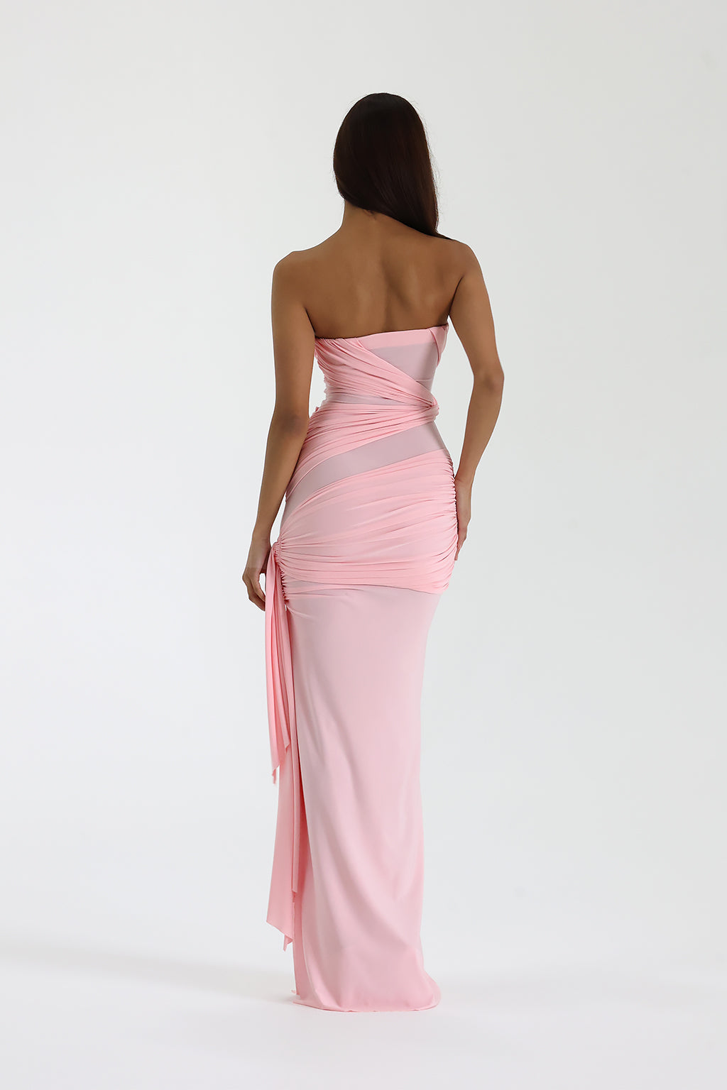 Back view of strapless pink maxi dress showing draped ruching and elegant silhouette